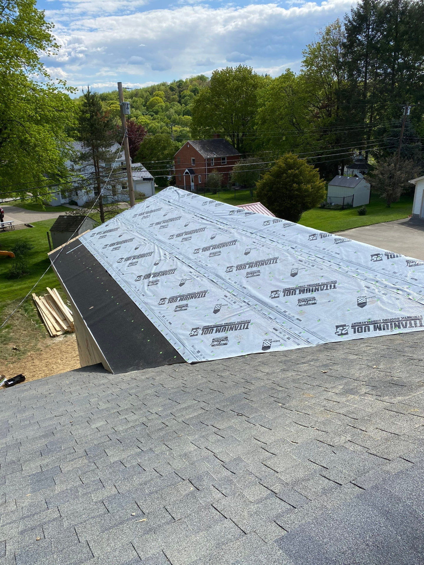 Titanium UDL synthetic underlayment and ice-and-water shield installed over new decking on a steep slope