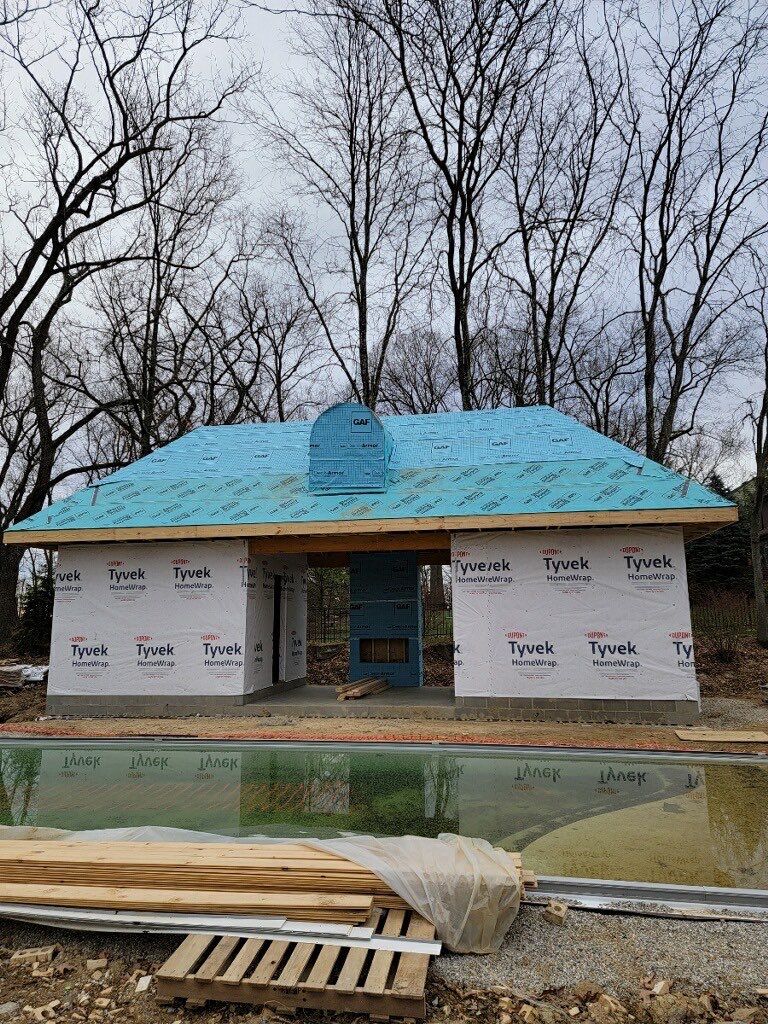 Poolhouse framed with Tyvek walls and GAF StormGuard covering the hip roof and cupola