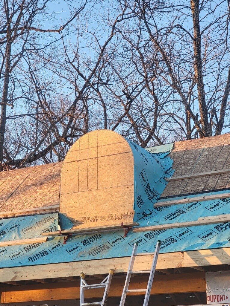 Barrel dormer sheathed over GAF StormGuard leak barrier before shingles